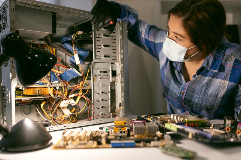 A technician performing Desktop Repairs at Horizon Phone Shop.